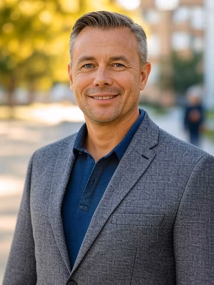 Fit 40-year-old man in casual elegant attire, outdoor urban setting, confident posture, natural smil